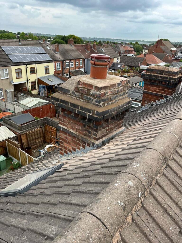 This is a photo taken from a roof which is being repaired by Isleham Roofing Repairs, it shows a street of houses, and their roofs